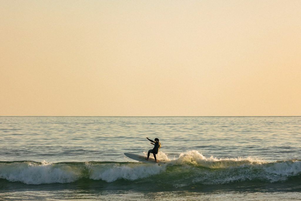 Surfer enjoys a wave on the ocean.